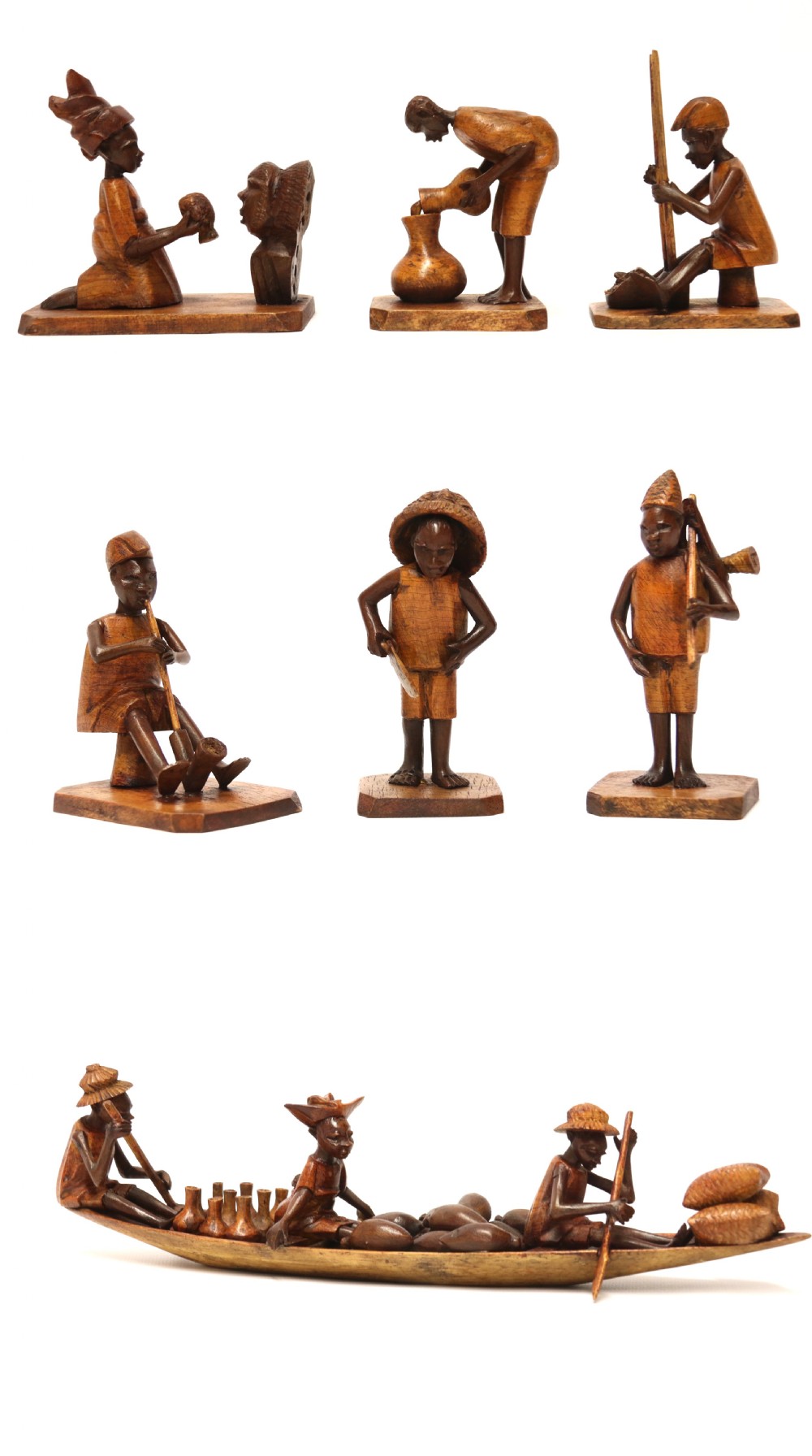 A collection of hand-carved warm brown hardwood figures from Nigeria depicting individuals engaged in daily tasks alongside a carved canoe. View XXII
