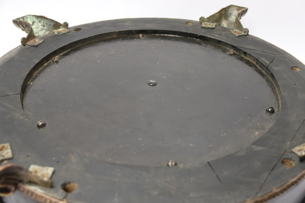 An antique French roulette wheel with ebonised wood casing and brass claw feet, set in front of an original dark green felt layout cloth printed with gold French gaming text. View VII