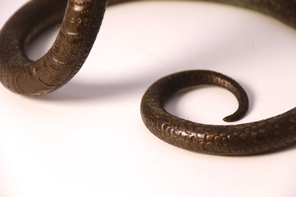 A pair of Raj period Indian bronze candlesticks in the form of striking cobras, c 1890 View XV