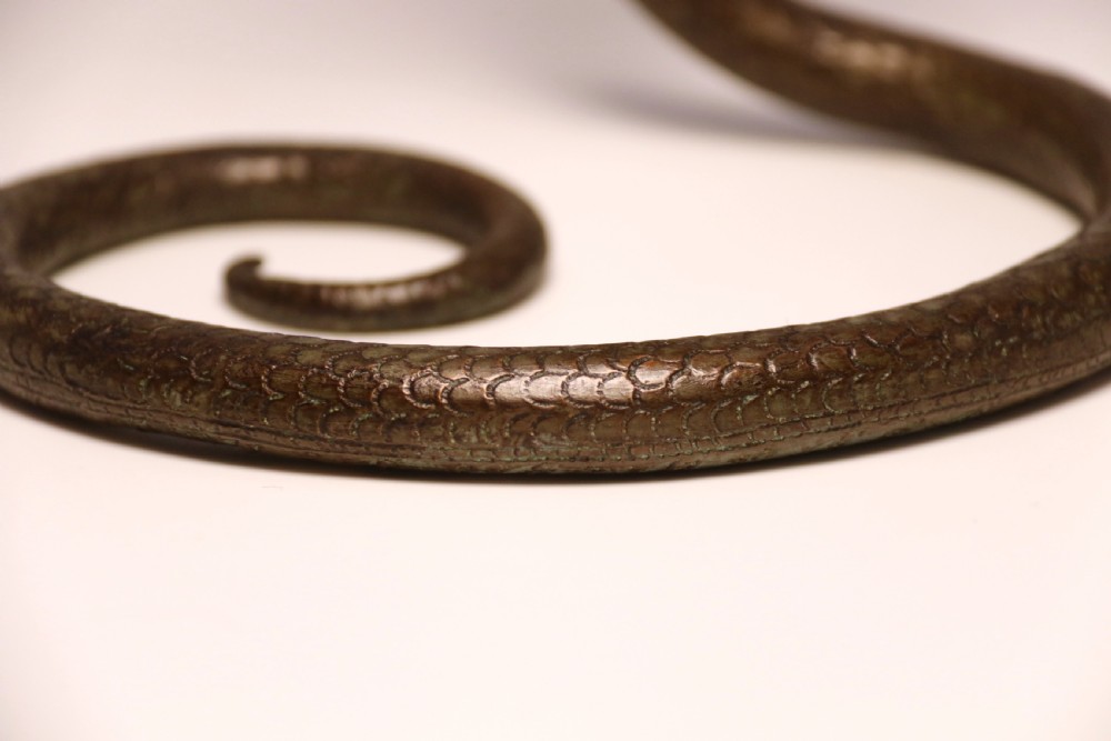 A pair of Raj period Indian bronze candlesticks in the form of striking cobras, c 1890 View XIX