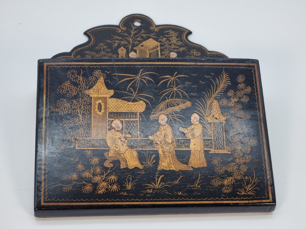 A 19th century Chinese export chinoiserie decorated papier mache  wall pocket.

 View VII