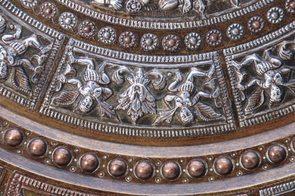 A superb Raj period silver, copper and brass repousse work charger. View IX