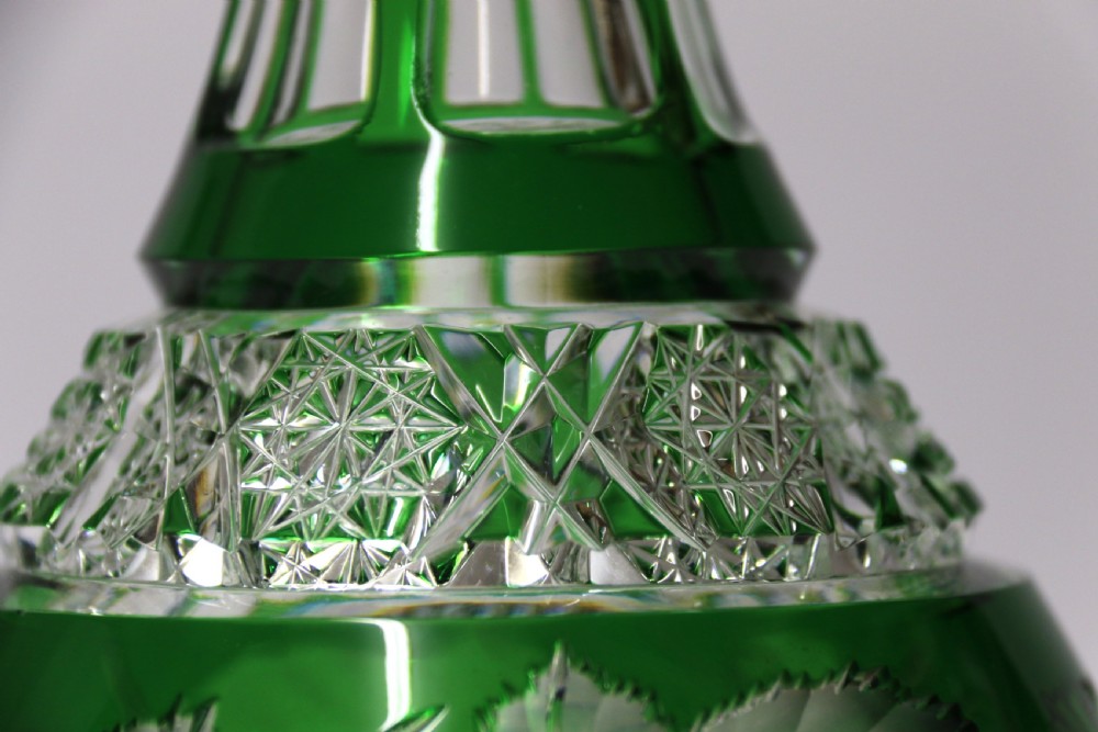 A Bohemian silver topped green overlaid and deeply cut and carved glass spirit decanter. View IV
