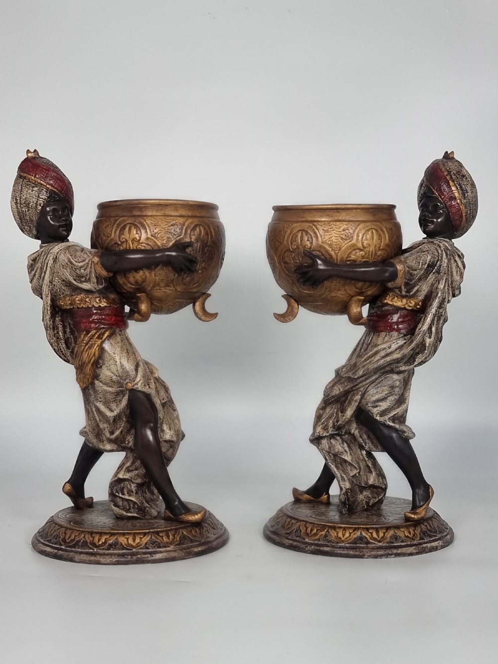 A cast and cold painted pair of Blackamoor figure jardinieres 