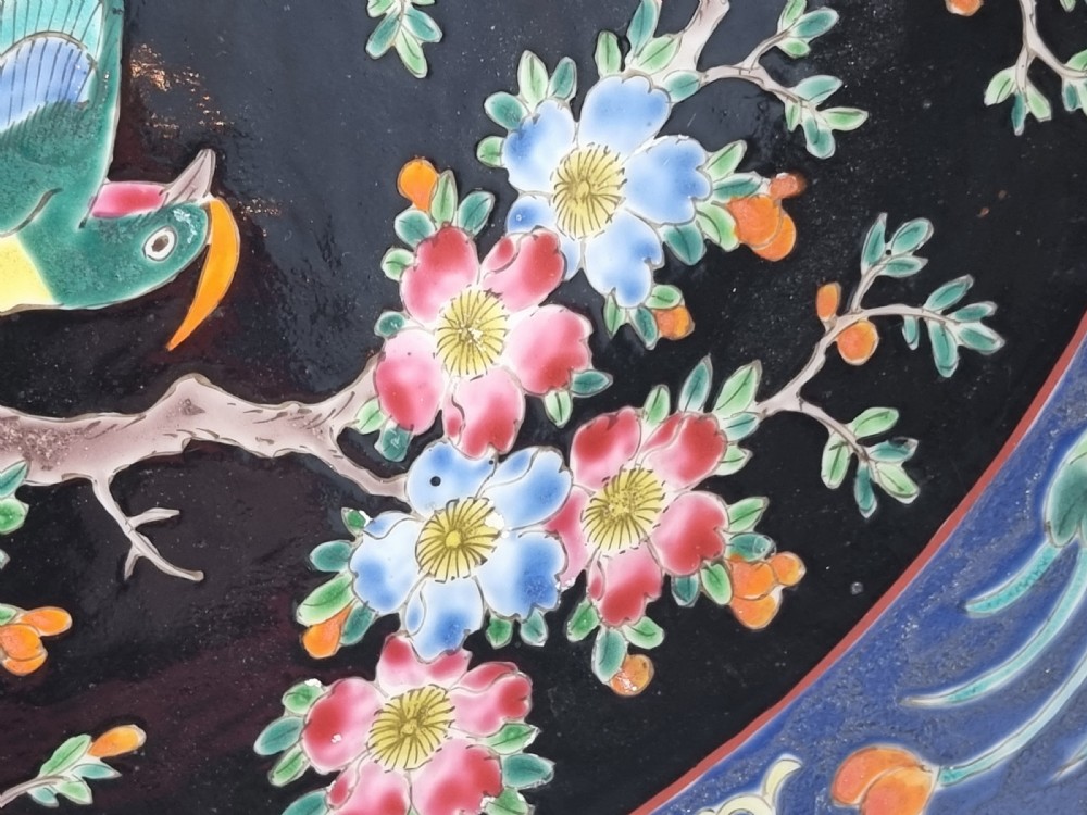 A large Chinese wall charger in famille noire porcelain View X