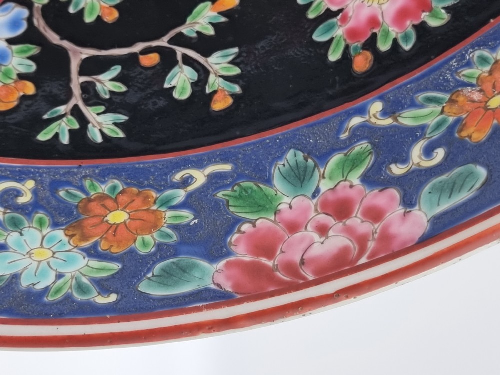 A large Chinese wall charger in famille noire porcelain View XI