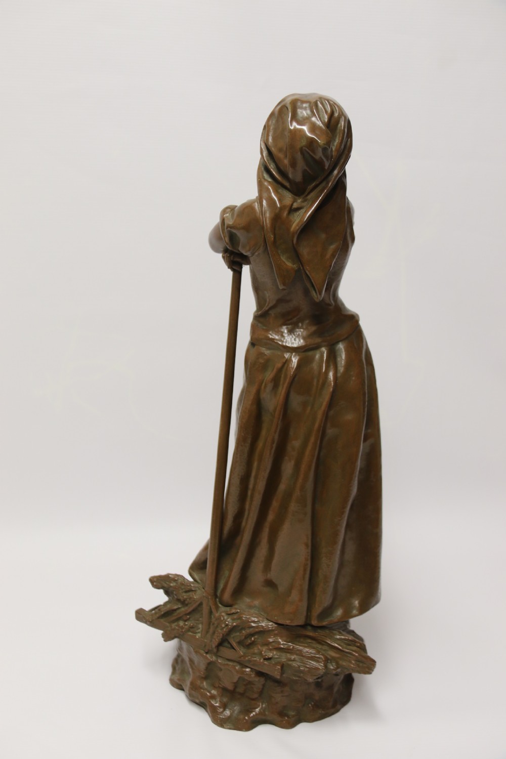 A 19th century  French bronze sculpture of a young female gathering hey at harvest View VI