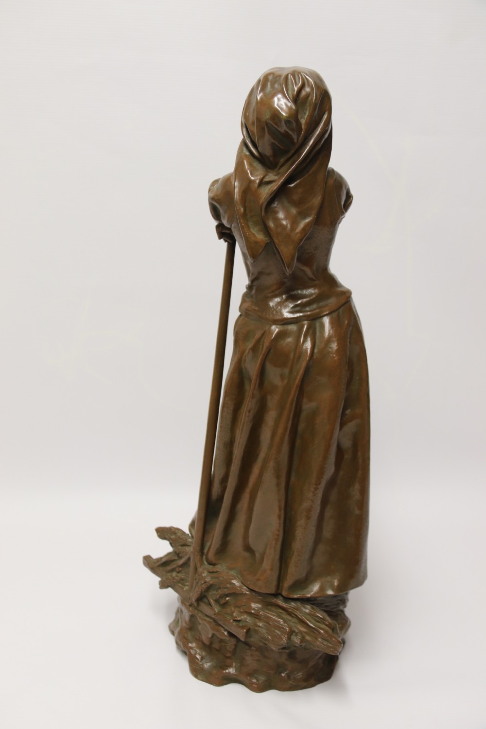 A 19th century  French bronze sculpture of a young female gathering hey at harvest View VII