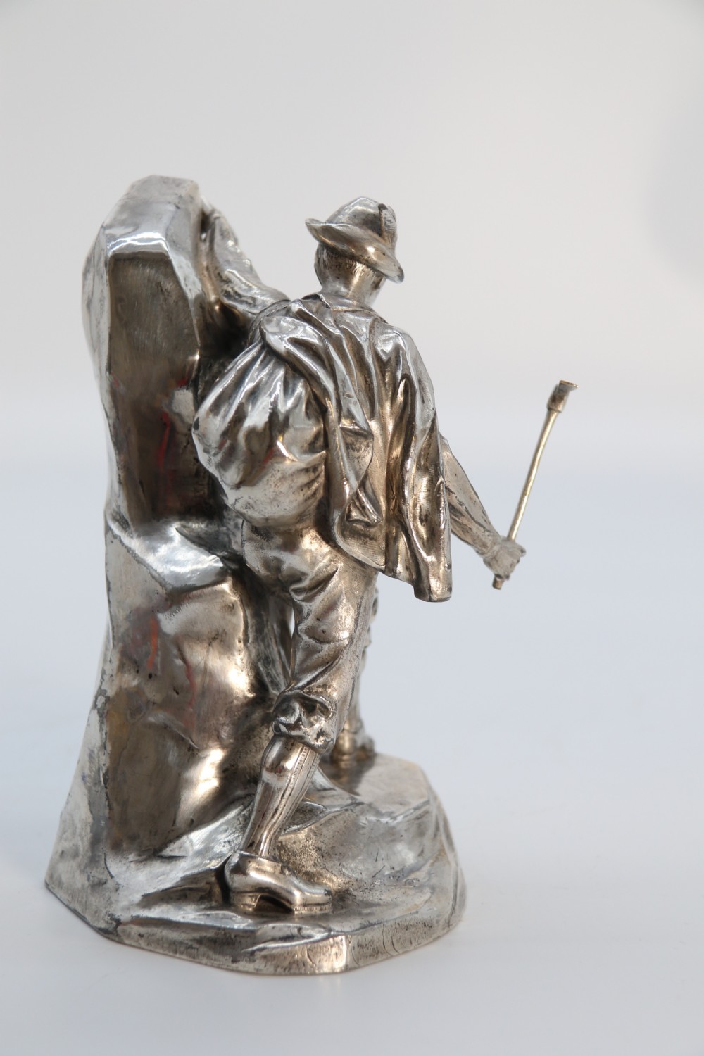 A  WMF cast metal and silver plated sculpture of an early 20th century mountaineer climbing a rock face, c 1910


 View V