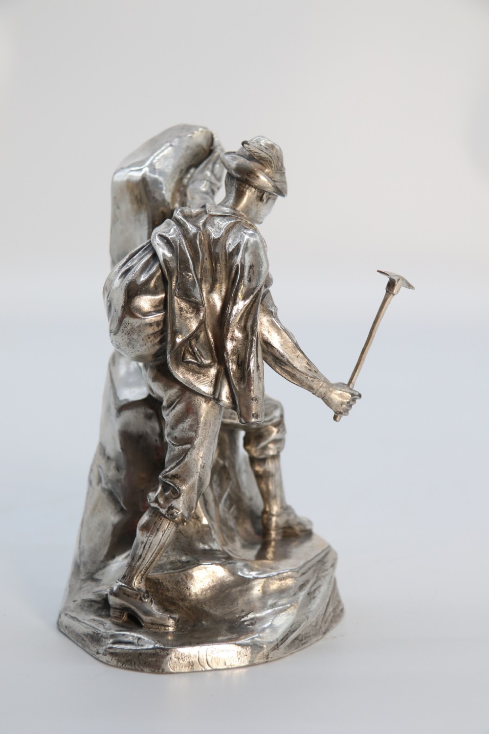 A  WMF cast metal and silver plated sculpture of an early 20th century mountaineer climbing a rock face, c 1910


 View VI