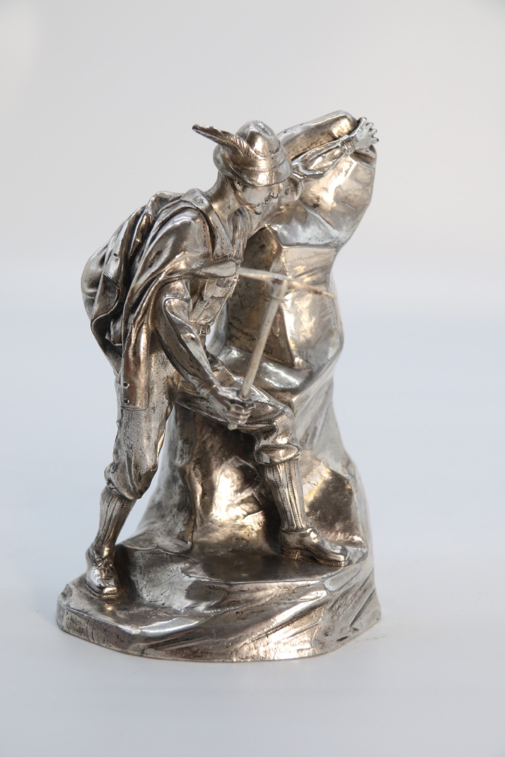 A  WMF cast metal and silver plated sculpture of an early 20th century mountaineer climbing a rock face, c 1910


 View VII
