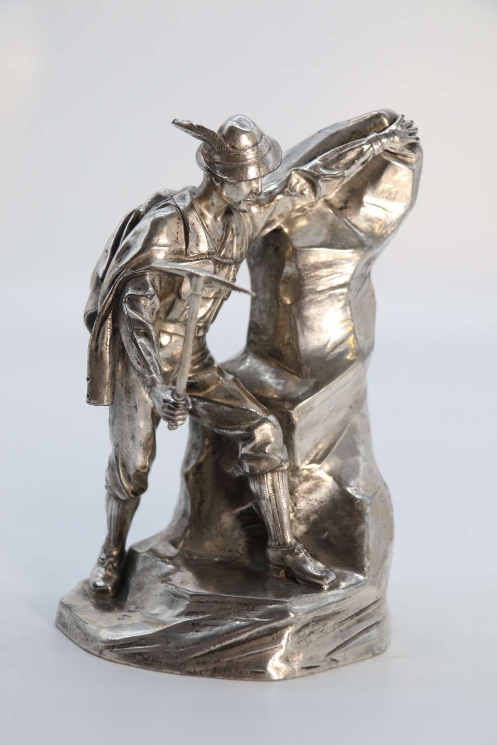 A  WMF cast metal and silver plated sculpture of an early 20th century mountaineer climbing a rock face, c 1910


 View VIII