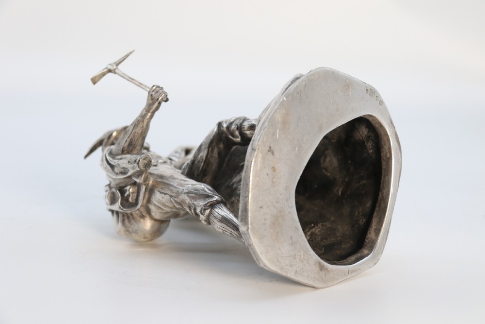 A  WMF cast metal and silver plated sculpture of an early 20th century mountaineer climbing a rock face, c 1910


 View XIII