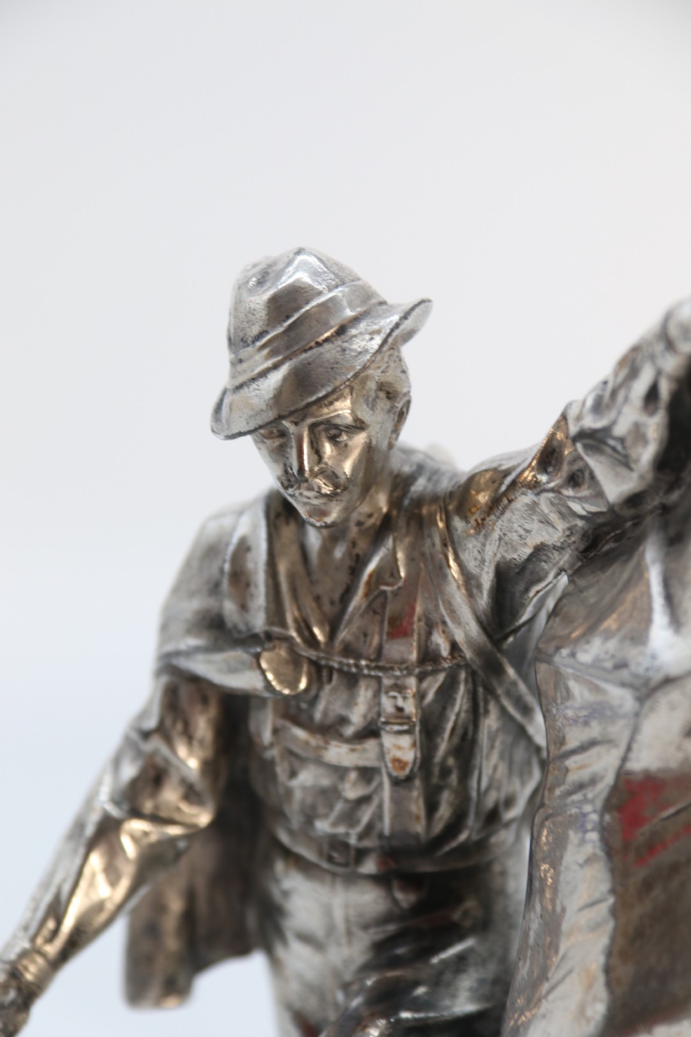 A  WMF cast metal and silver plated sculpture of an early 20th century mountaineer climbing a rock face, c 1910


 View XV