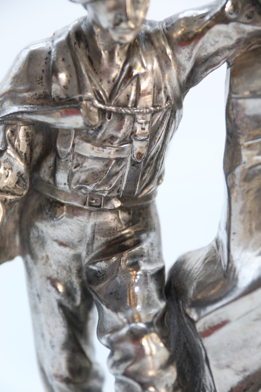 A  WMF cast metal and silver plated sculpture of an early 20th century mountaineer climbing a rock face, c 1910


 View XVI