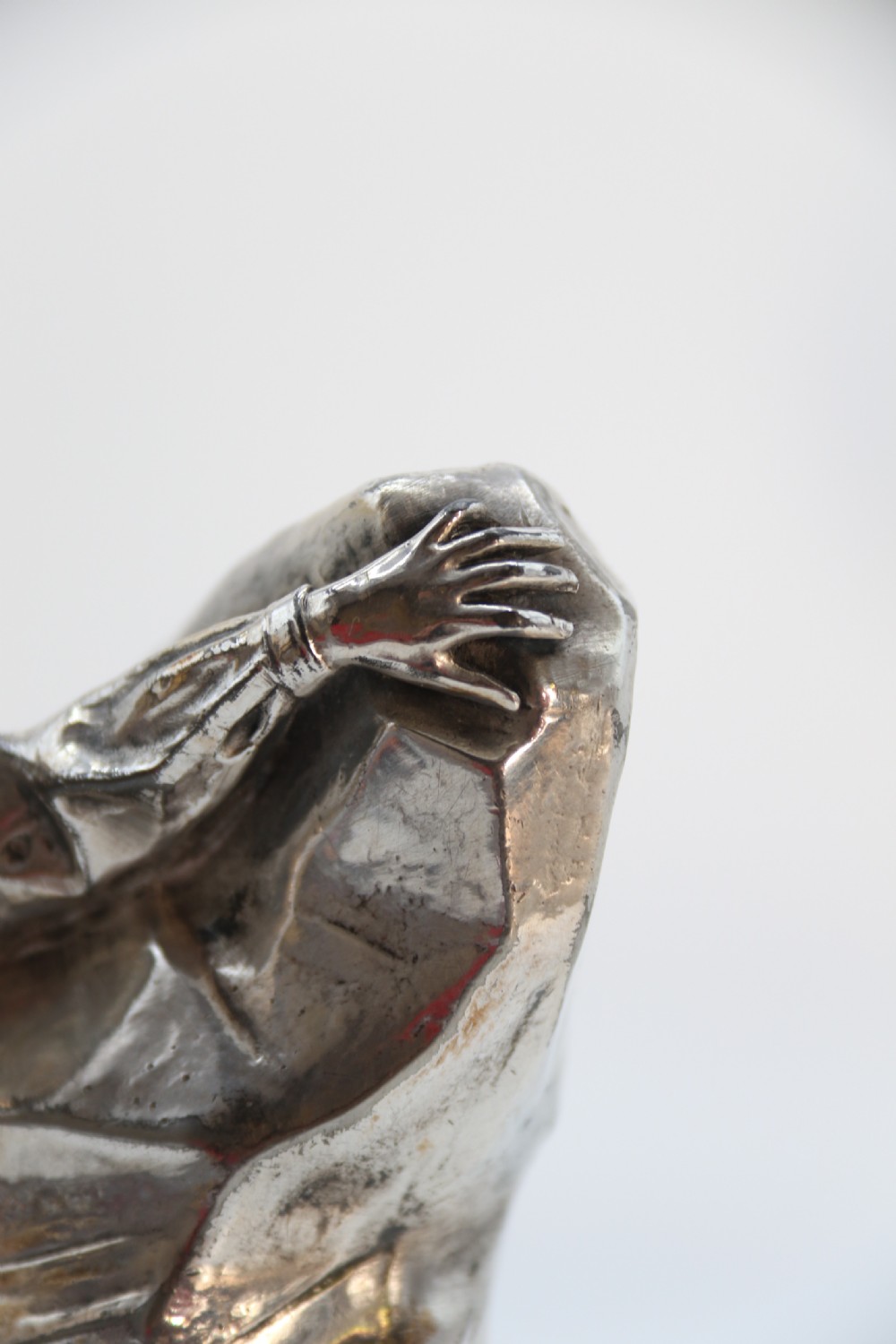 A  WMF cast metal and silver plated sculpture of an early 20th century mountaineer climbing a rock face, c 1910


 View XVII