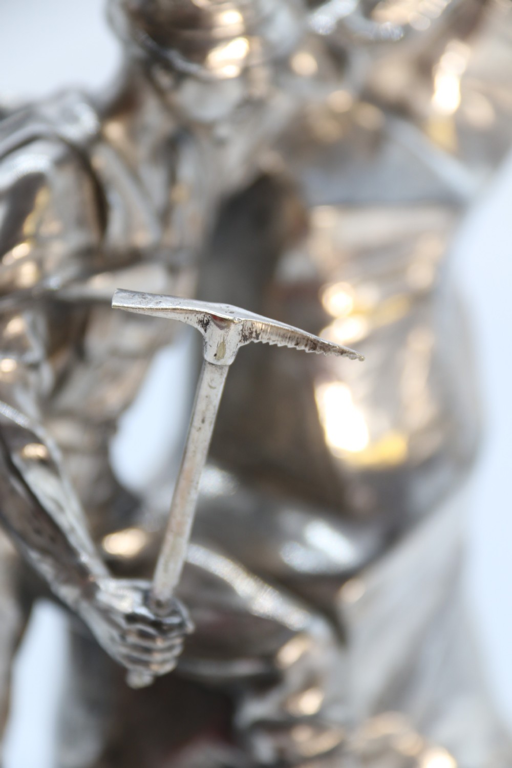 A  WMF cast metal and silver plated sculpture of an early 20th century mountaineer climbing a rock face, c 1910


 View XVIII