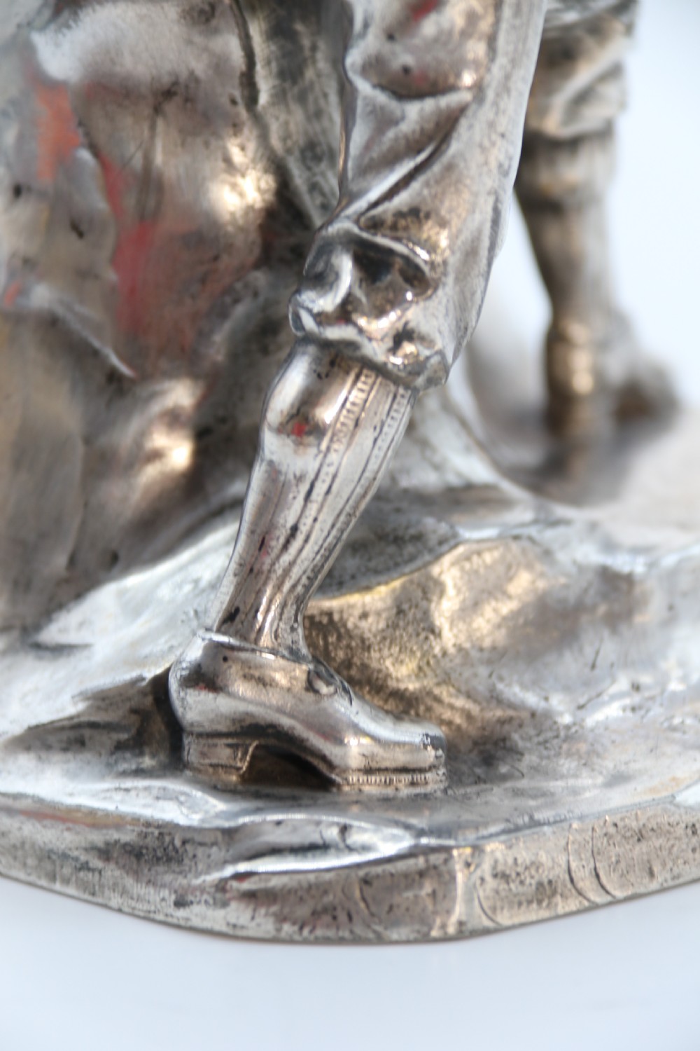 A  WMF cast metal and silver plated sculpture of an early 20th century mountaineer climbing a rock face, c 1910


 View XIX