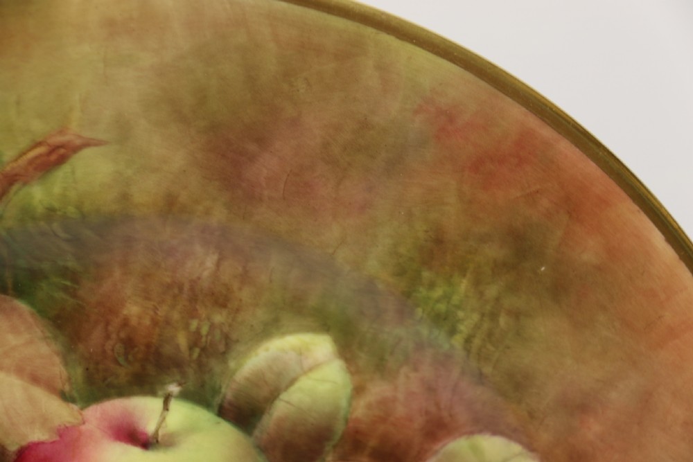 A pair of circular hand-painted porcelain plates displaying still life compositions of peaches, grapes, and blackberries framed by gilded scalloped edges. View XXI