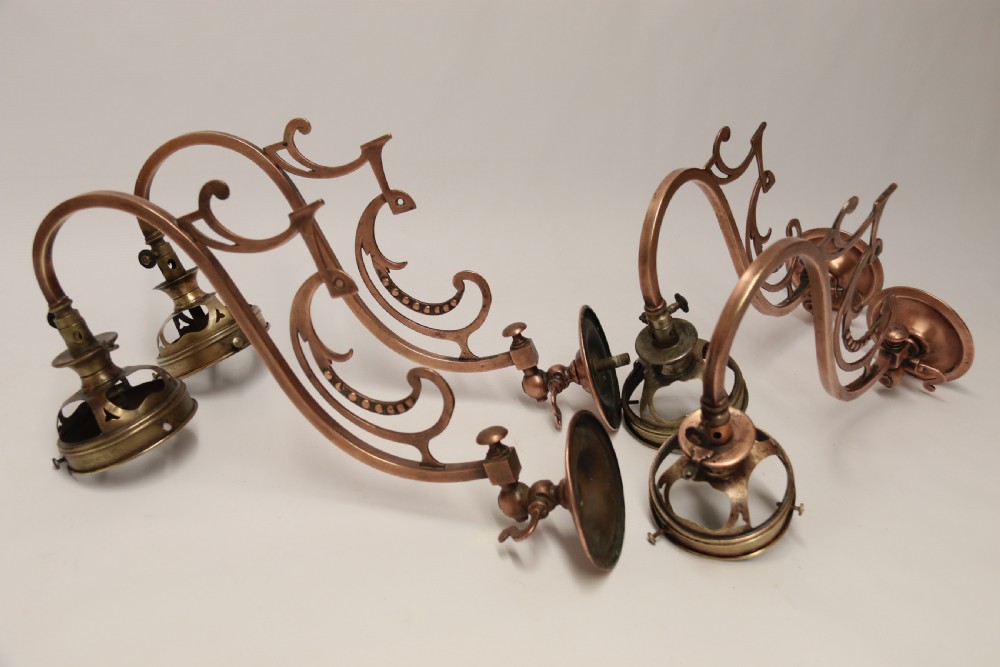 A stylish set of four early 20th century copper arts and crafts gas wall lights View VI