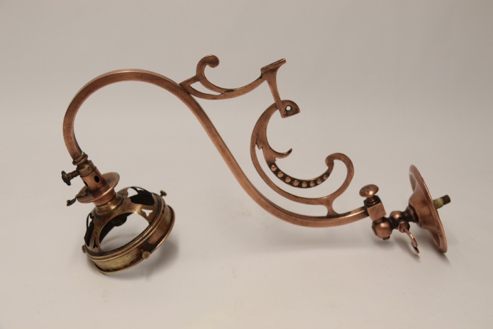 A stylish set of four early 20th century copper arts and crafts gas wall lights View IX