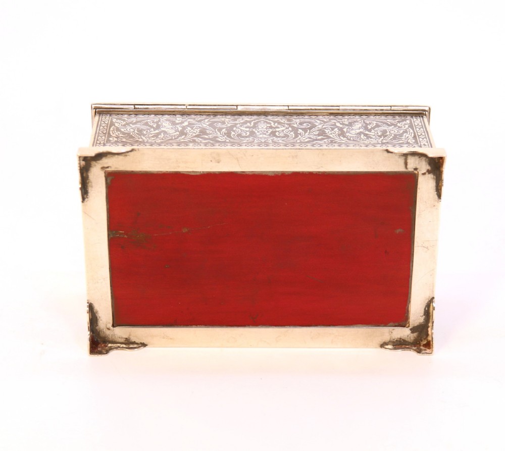 A rectangular sterling silver box featuring intricate black niello inlay artwork depicting a Thai temple architectural landscape on the lid and mythological figures along the sides. View VII