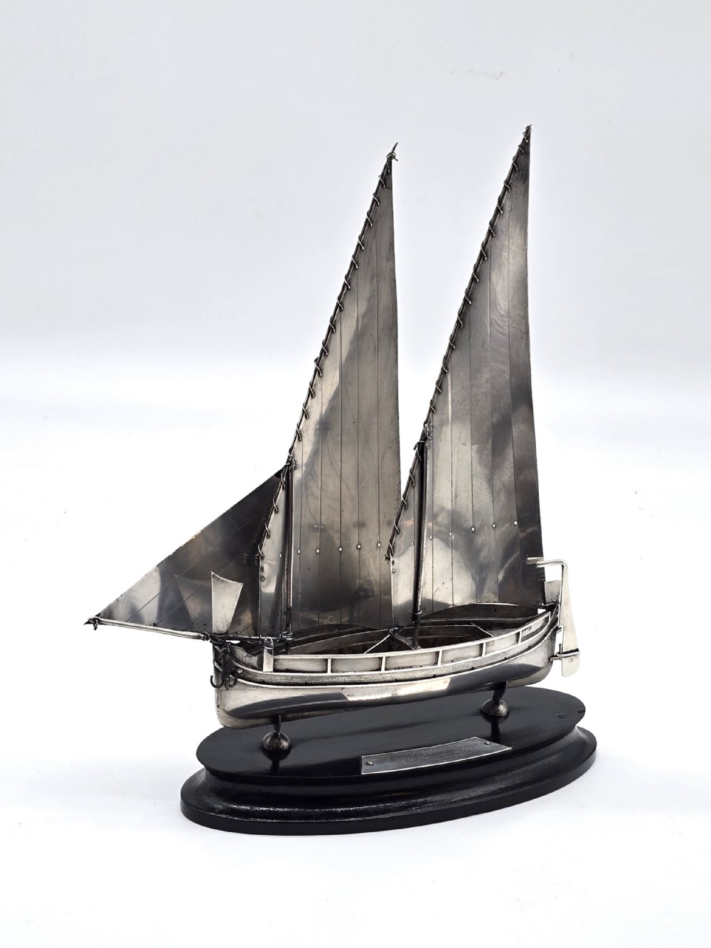 An important silver Royal military presentation boat from the palace staff to the Governor of Malta, Sir Robert Laycock Major General KCMG CB DSO KStJ