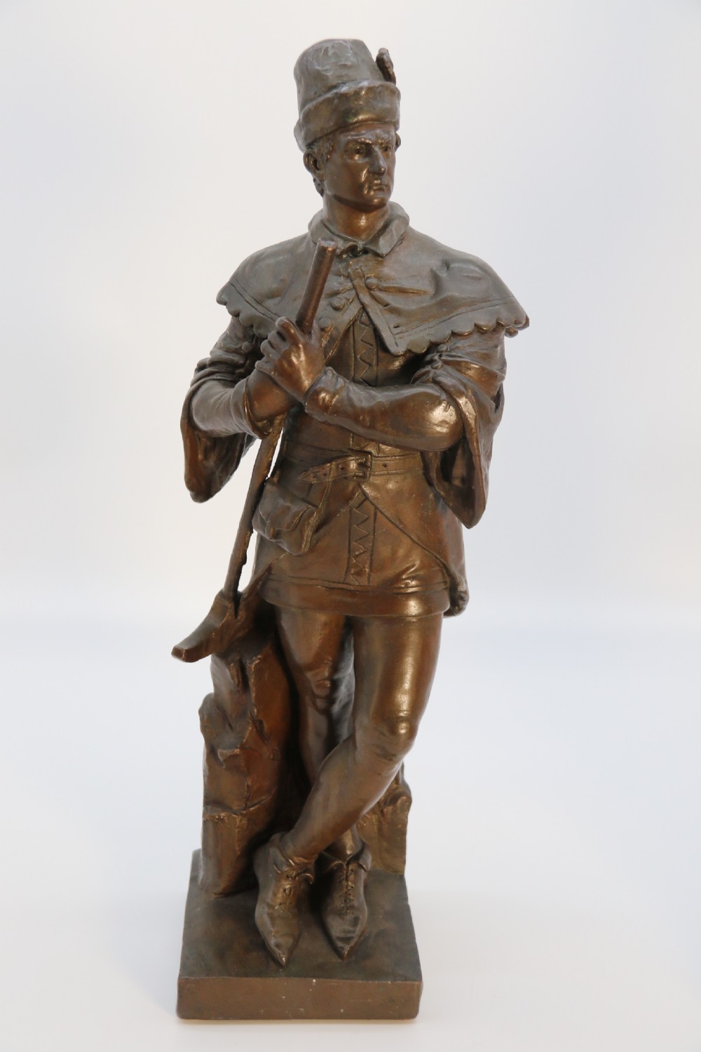 A pair of patinated electrotype bronze figures depicting historic tradesmen standing on rectangular plinths. View VIII