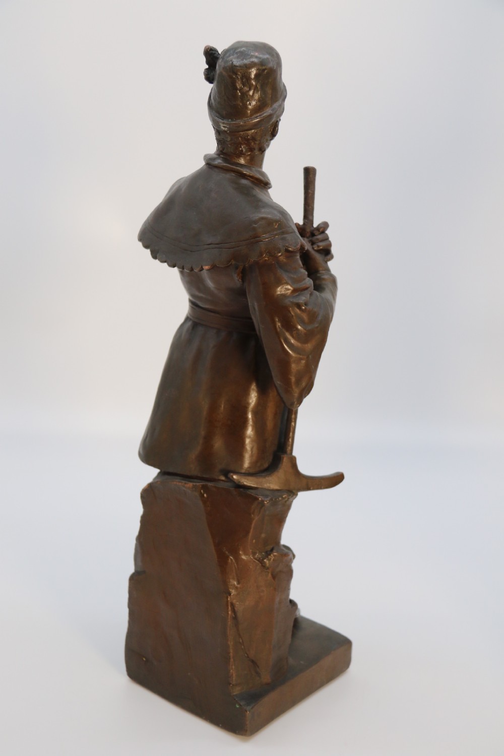 A pair of patinated electrotype bronze figures depicting historic tradesmen standing on rectangular plinths. View XI