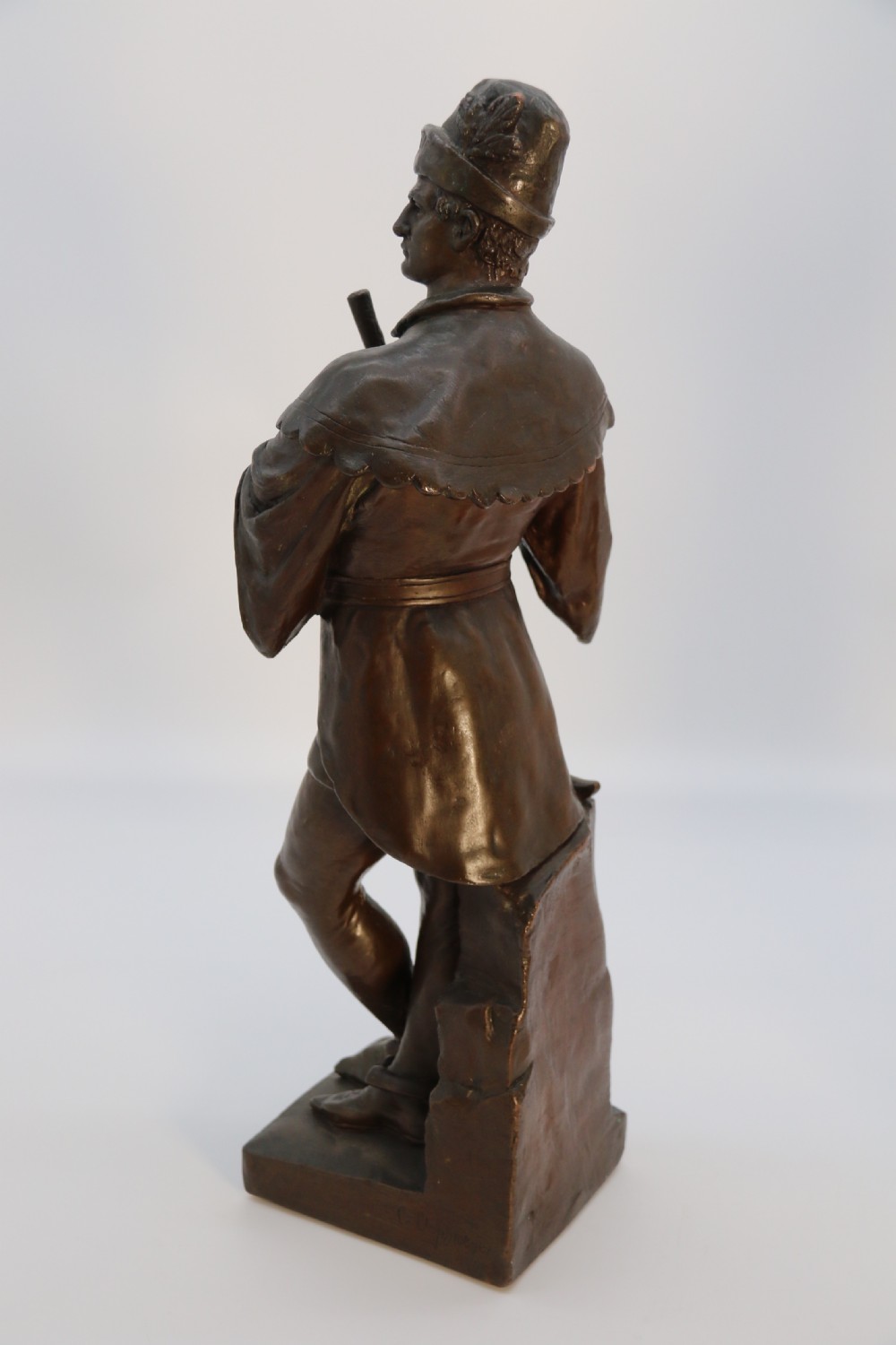 A pair of patinated electrotype bronze figures depicting historic tradesmen standing on rectangular plinths. View XIII