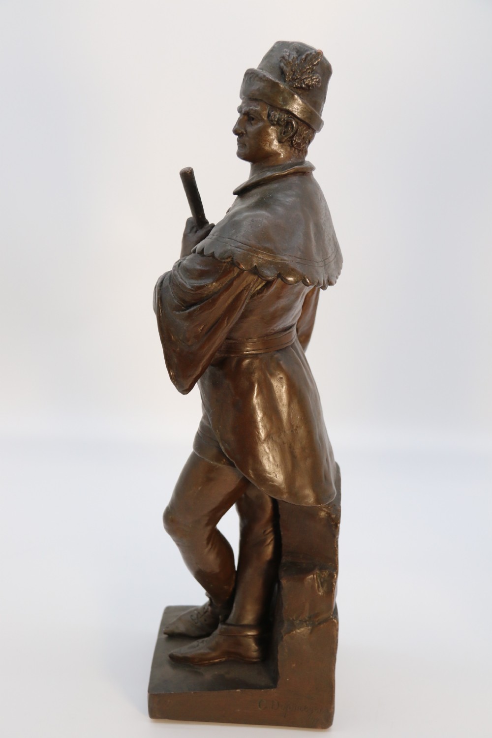 A pair of patinated electrotype bronze figures depicting historic tradesmen standing on rectangular plinths. View XIV