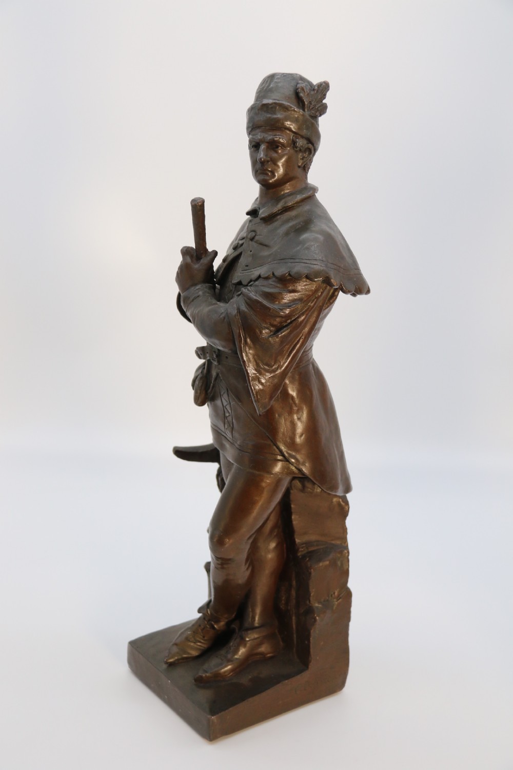 A pair of patinated electrotype bronze figures depicting historic tradesmen standing on rectangular plinths. View XV