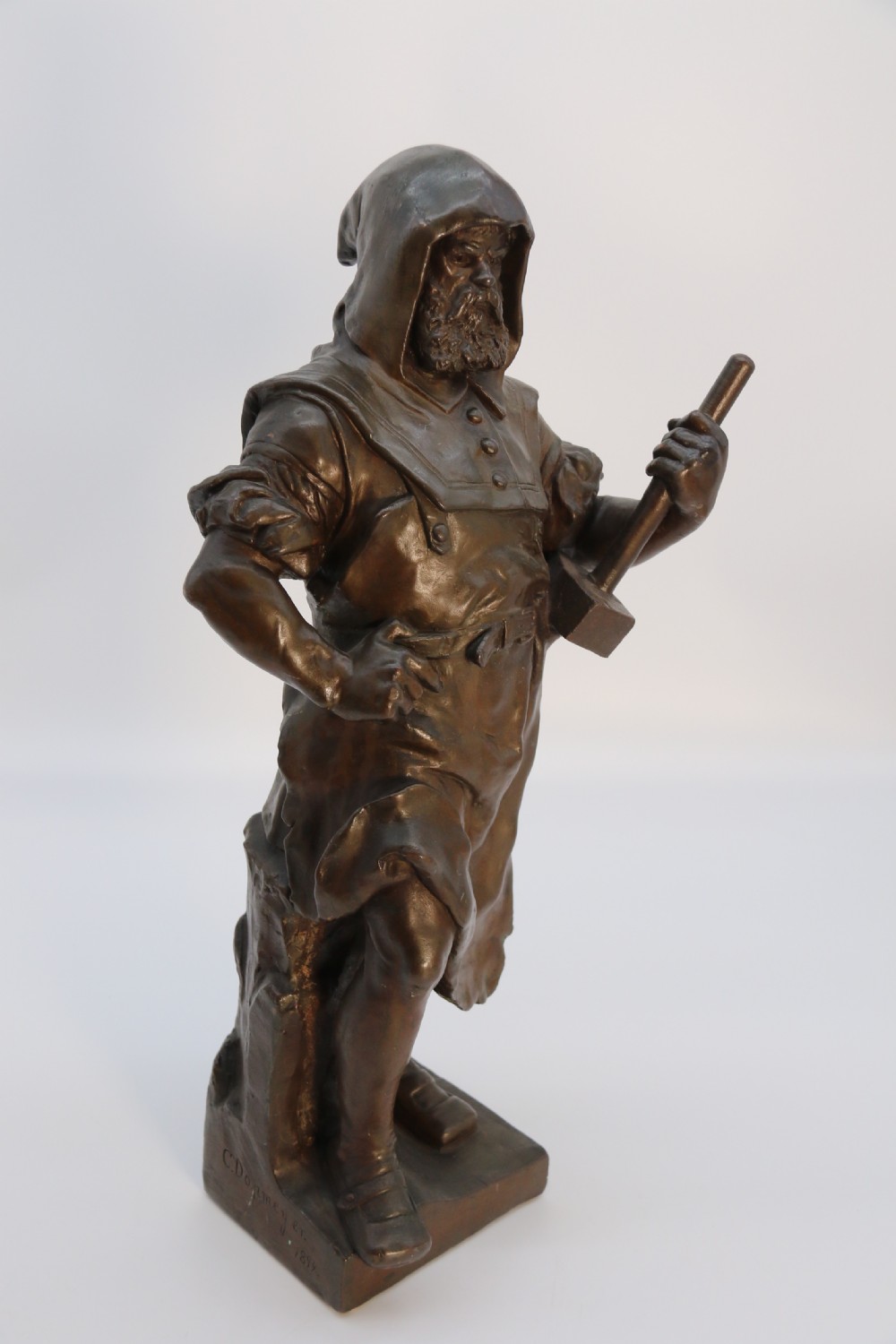 A pair of patinated electrotype bronze figures depicting historic tradesmen standing on rectangular plinths. View XXIV