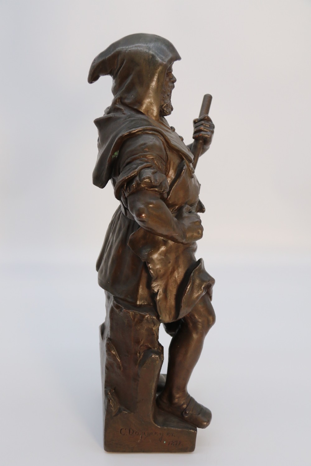 A pair of patinated electrotype bronze figures depicting historic tradesmen standing on rectangular plinths. View XXV