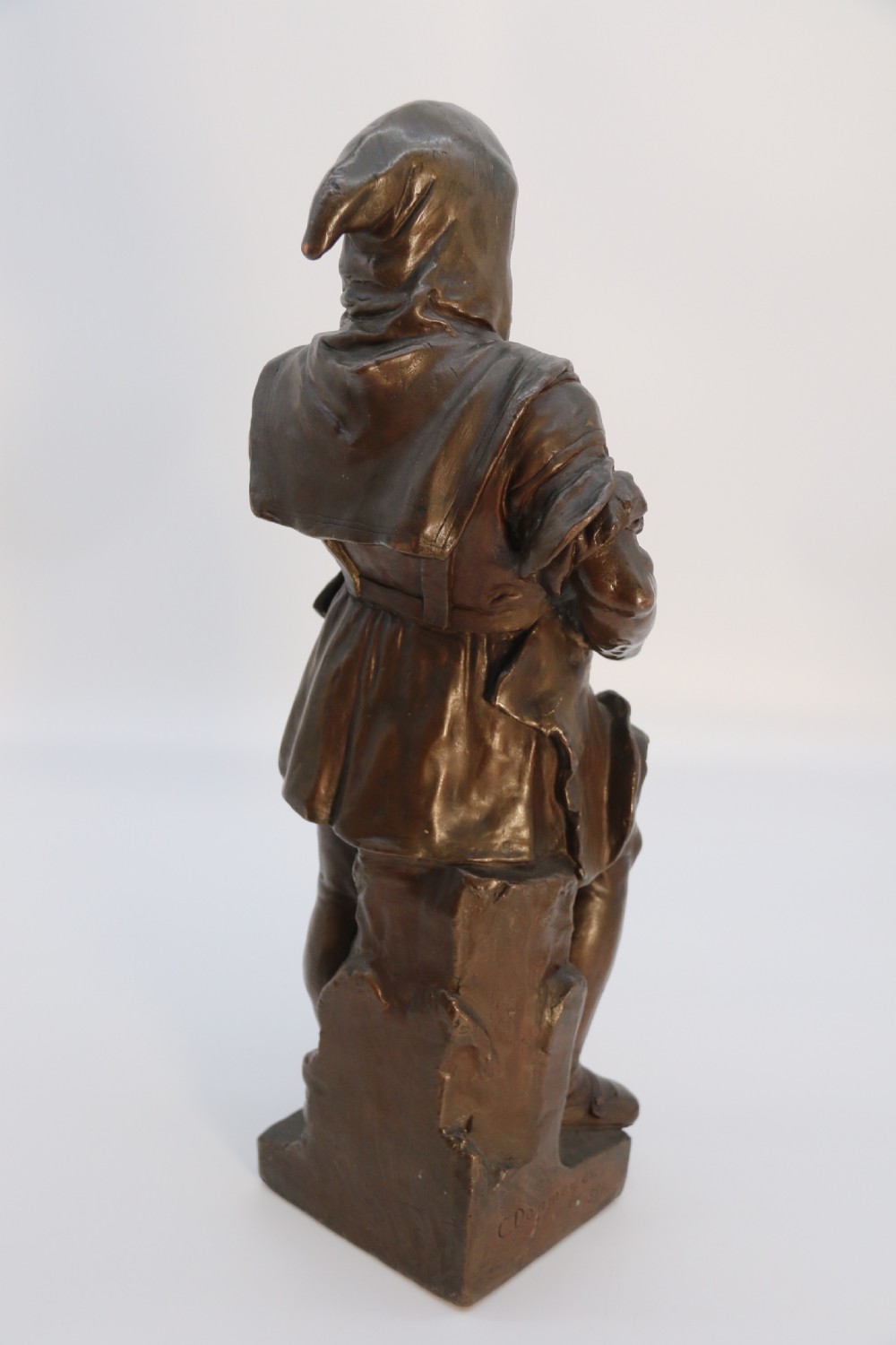 A pair of patinated electrotype bronze figures depicting historic tradesmen standing on rectangular plinths. View XXVI