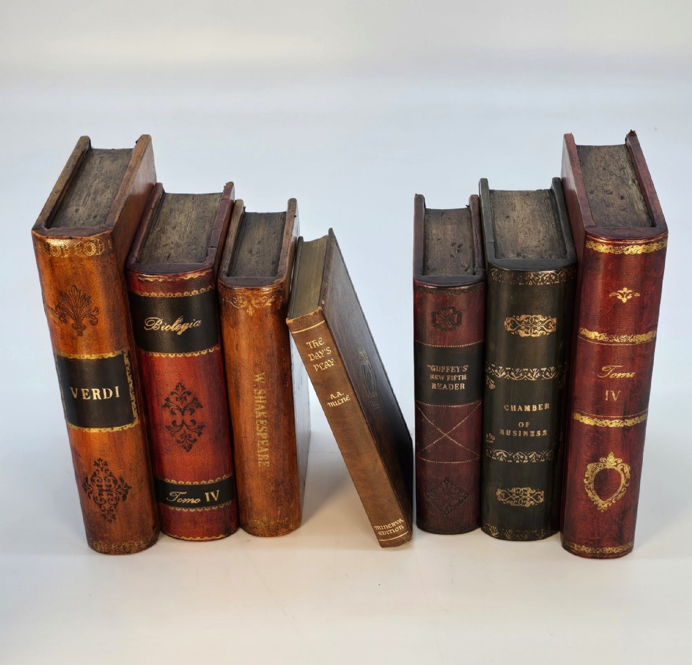A pair of bookends made in the form of antique leather bound books.