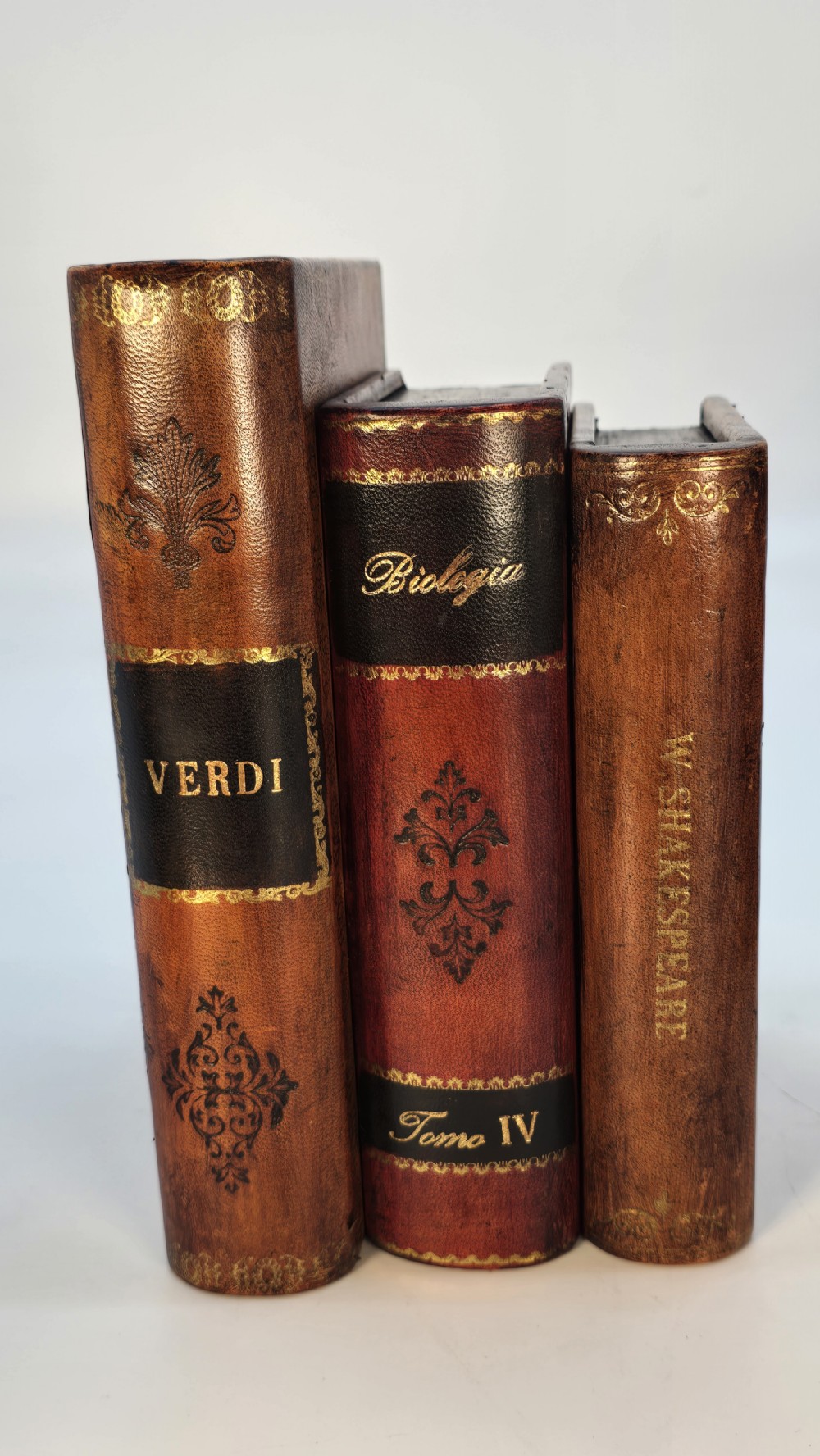 A pair of bookends made in the form of antique leather bound books. View X