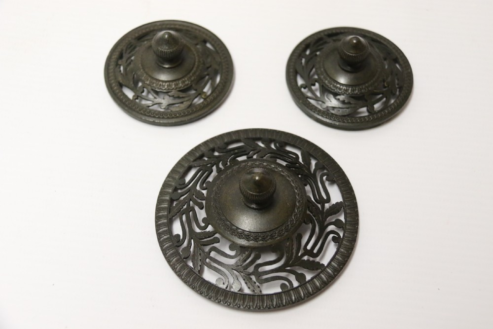 An Empire period dark green marble inkstand featuring dark patinated bronze cherub figures, twin urn inkwells, and carved claw feet. View VII