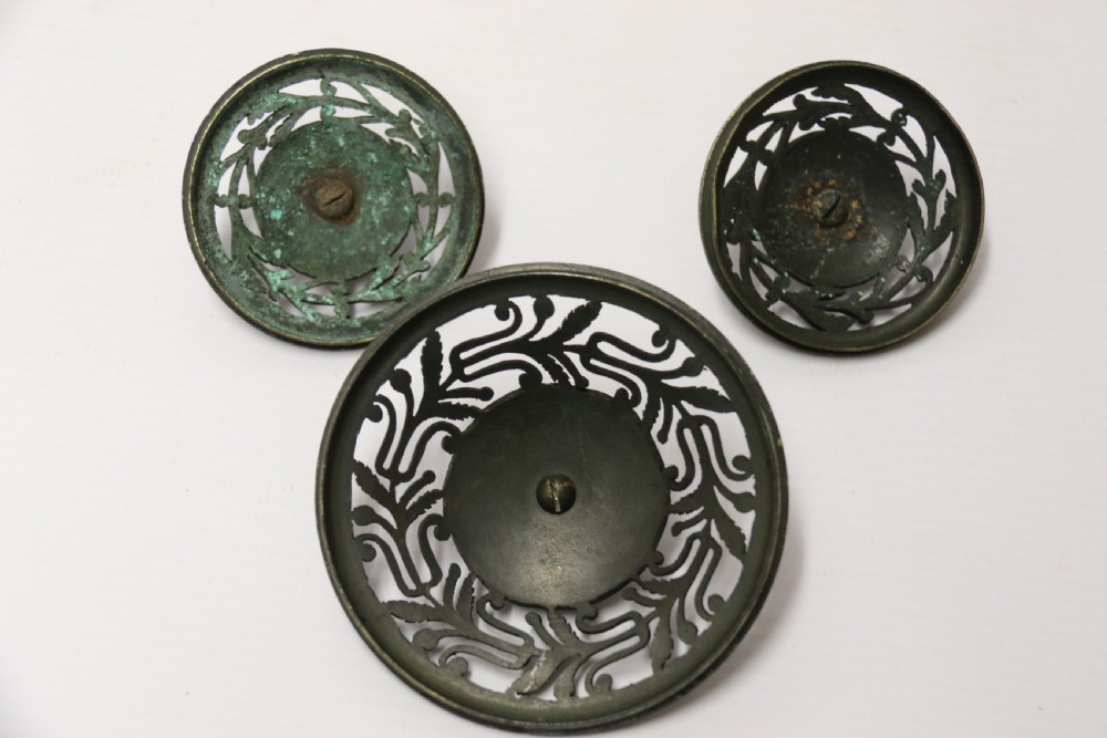 An Empire period dark green marble inkstand featuring dark patinated bronze cherub figures, twin urn inkwells, and carved claw feet. View VIII