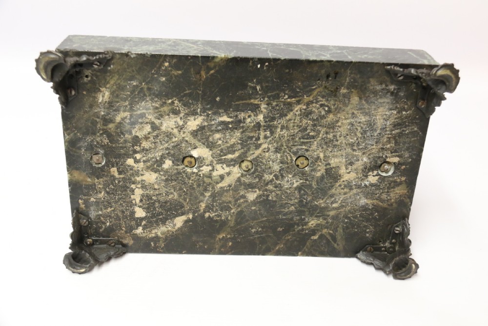 An Empire period dark green marble inkstand featuring dark patinated bronze cherub figures, twin urn inkwells, and carved claw feet. View XIV