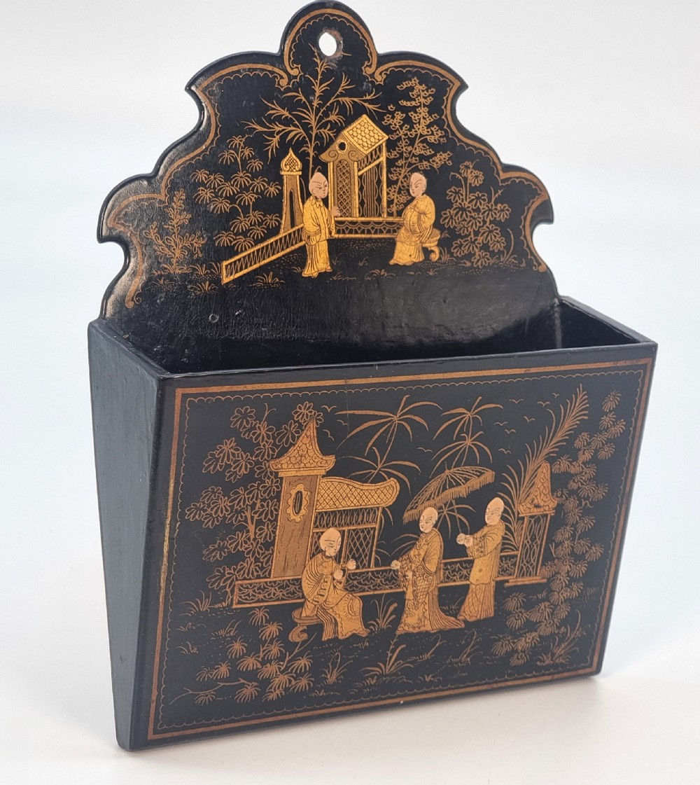 A 19th century Chinese export chinoiserie decorated papier mache  wall pocket.

 View V