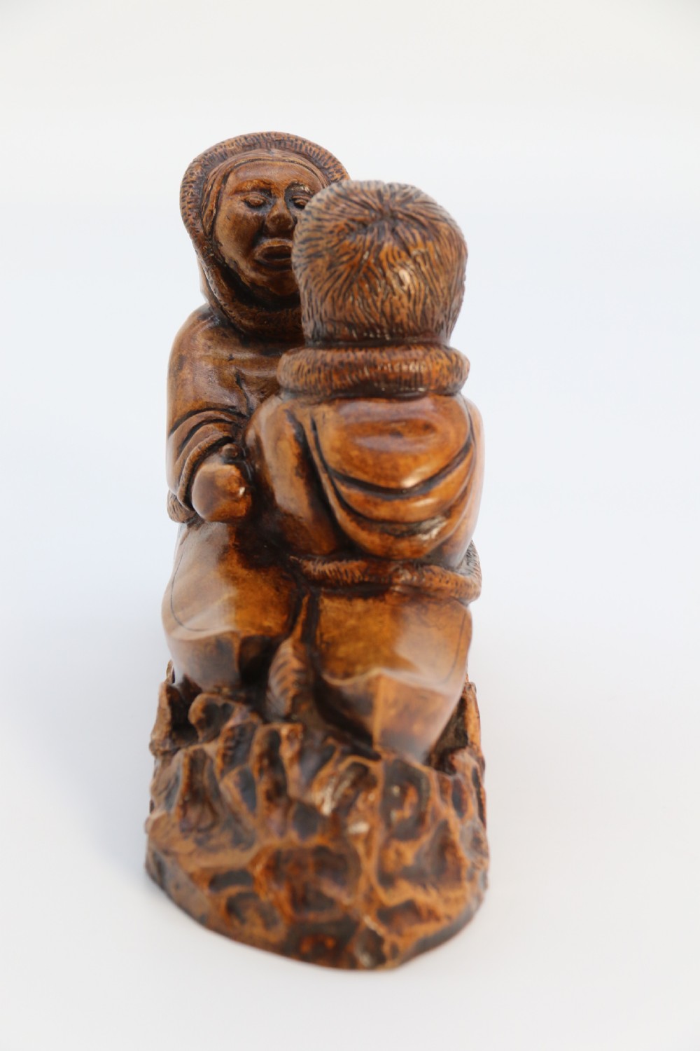 A rare early 20th century Canadian folk art maple wood carved Inuit figure group View II