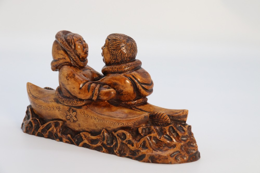 A rare early 20th century Canadian folk art maple wood carved Inuit figure group View III