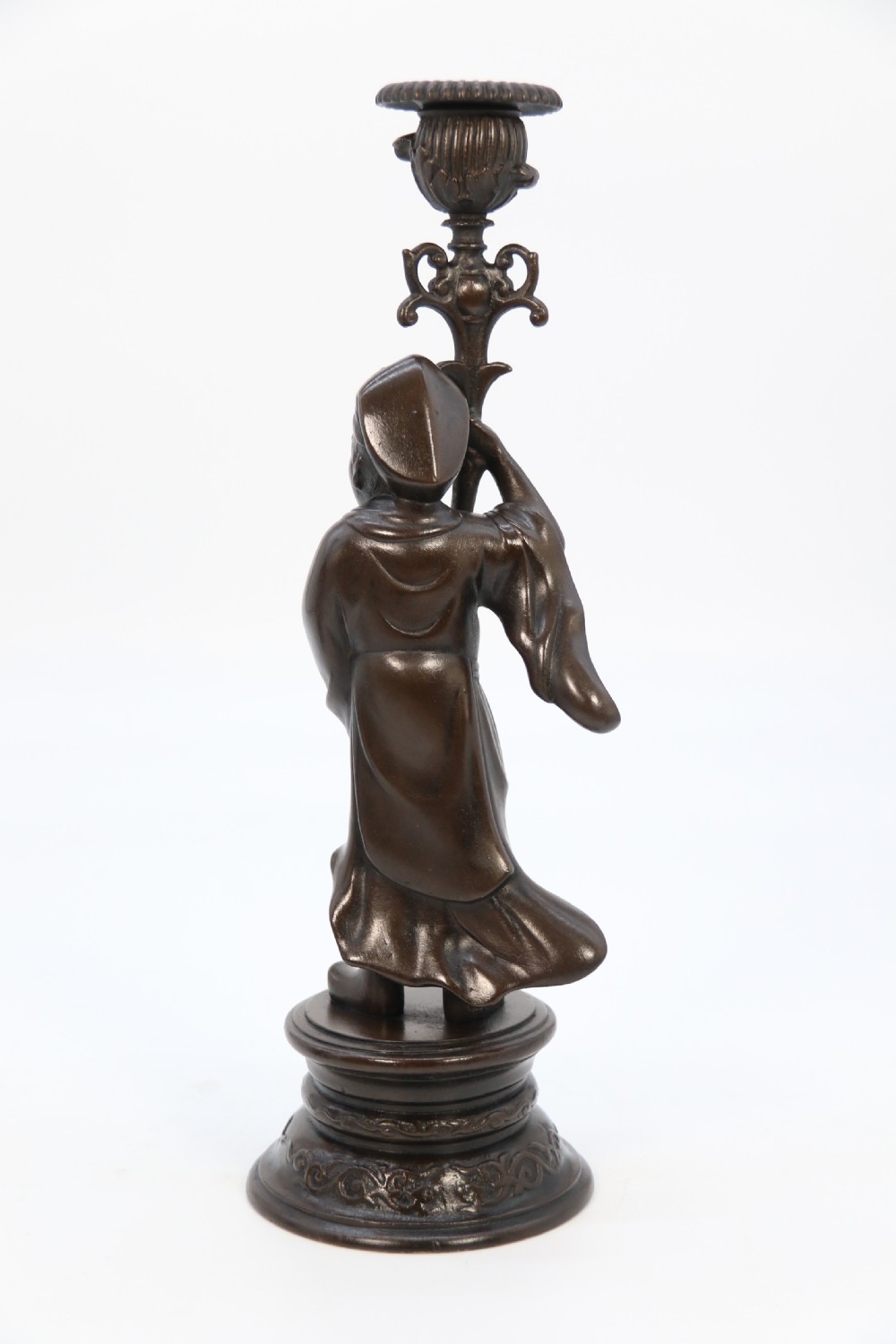 A pair of 19th-century French dark bronze candlesticks sculpted as standing Chinese figures holding flower-shaped candle nozzles on stepped round bases. View XII