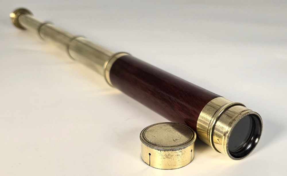 A superb 19th C telescope, pocket sized in brass and mahogany.