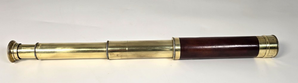 A superb 19th C telescope, pocket sized in brass and mahogany. View VIII