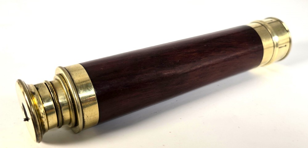 A superb 19th C telescope, pocket sized in brass and mahogany. View X