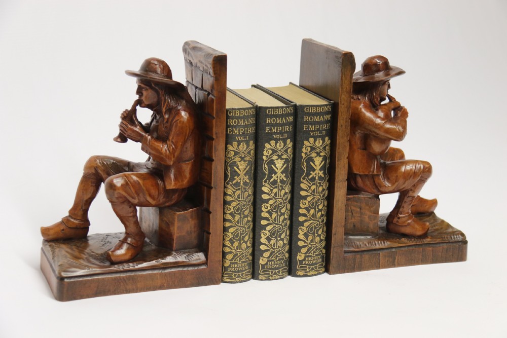 A pair of Black Forest carved walnut bookends circa 1900