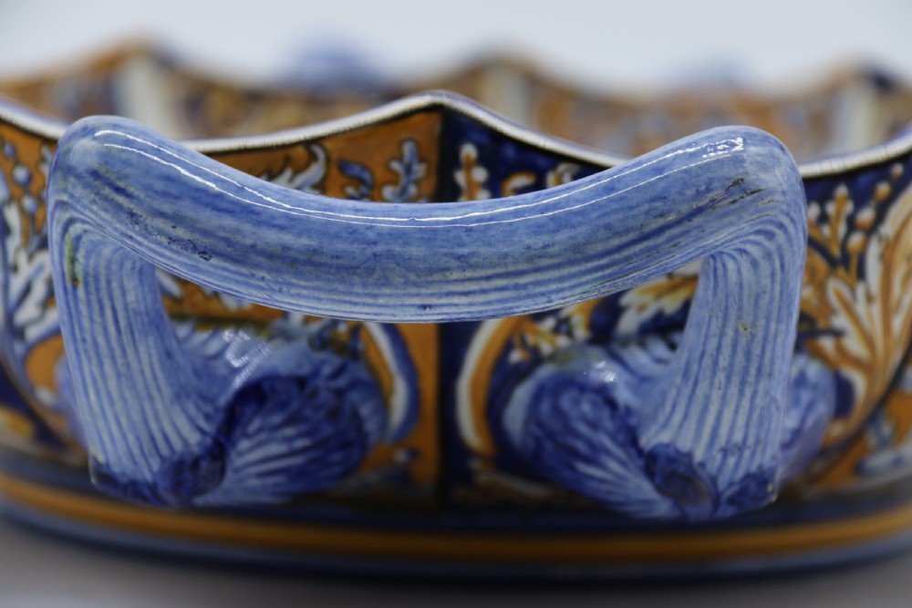 A hand-painted French Gien faience earthenware centrepiece dish with twin handles, decorated in cobalt blue and yellow mythological figures and acanthus scrollwork. View XVIII
