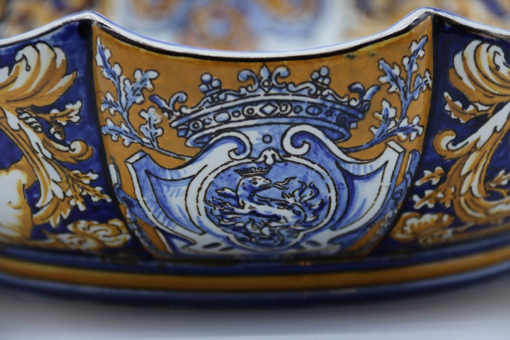 A hand-painted French Gien faience earthenware centrepiece dish with twin handles, decorated in cobalt blue and yellow mythological figures and acanthus scrollwork. View XXI